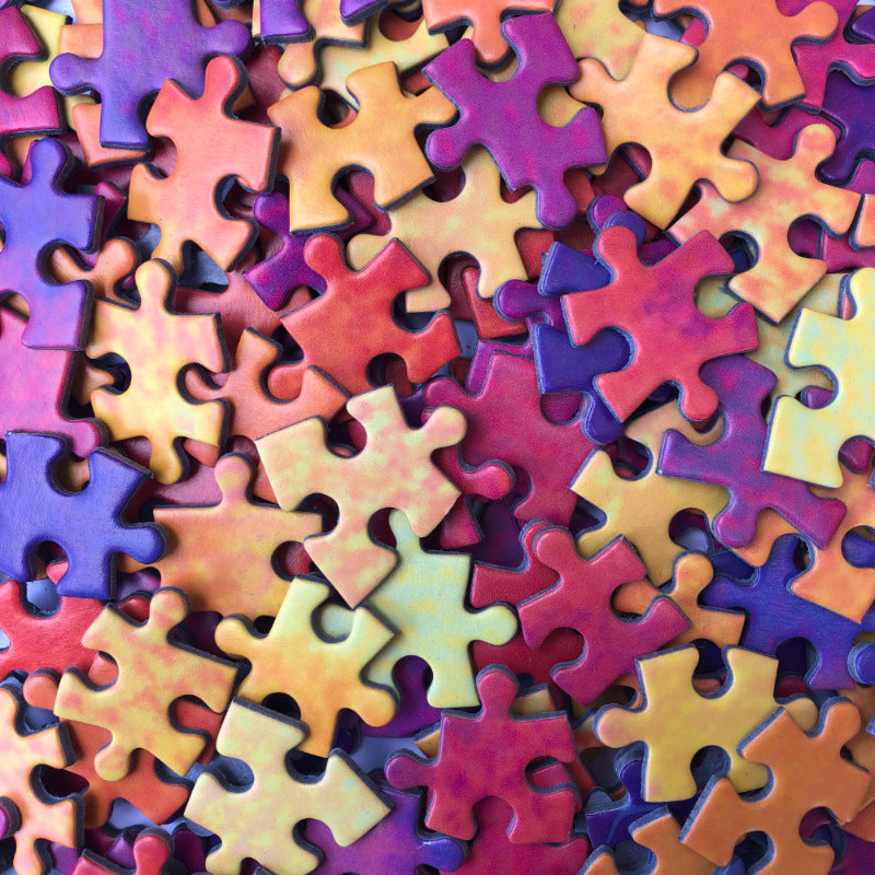 Close up of colourful jigsaw puzzle pieces
